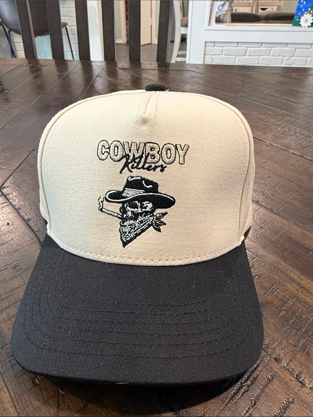 Cowboy Killers Embroidered Trucker Hat in Cream and Black. The Happiest Brand.